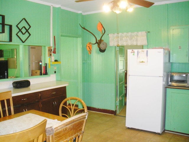928 Lanai Ave, Lanai City, HI 96763 - kitchen featuring freestanding refrigerator, a ceiling fan, crown molding, light countertops, and dark brown cabinets