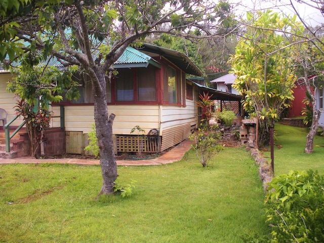928 Lanai Ave, Lanai City, HI 96763 - view of property exterior with a lawn