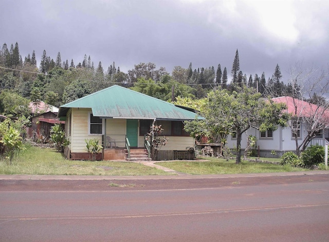 928 Lanai Ave, Lanai City, HI 96763 - view of front of home featuring covered porch and metal roof