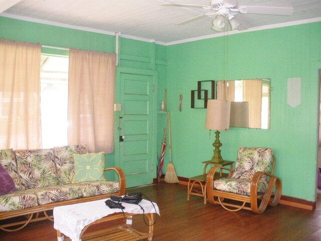 928 Lanai Ave, Lanai City, HI 96763 - living area featuring crown molding, wood finished floors, baseboards, and a ceiling fan