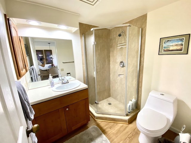50 Kepuhi Pl Unit 117, Maunaloa, HI 96770 - bathroom featuring wood finished floors, toilet, ensuite bathroom, vanity, and a stall shower