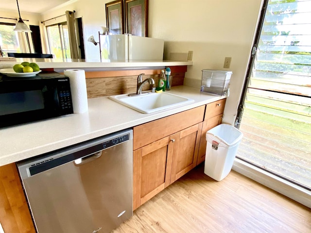 50 Kepuhi Pl Unit 117, Maunaloa, HI 96770 - kitchen with a sink, black microwave, light countertops, dishwasher, and light wood finished floors