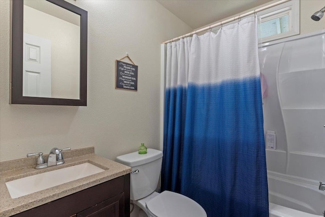 full bathroom featuring vanity, shower / bathtub combination with curtain, and toilet