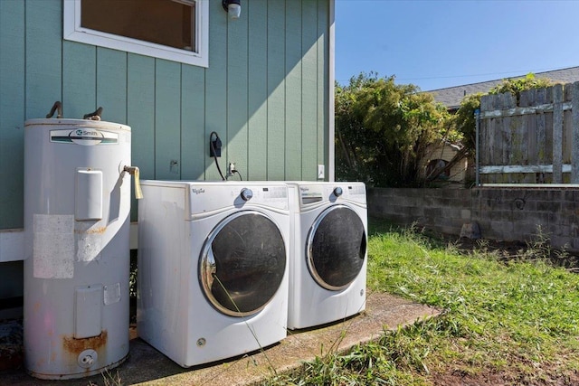 laundry room featuring independent washer and dryer and electric water heater