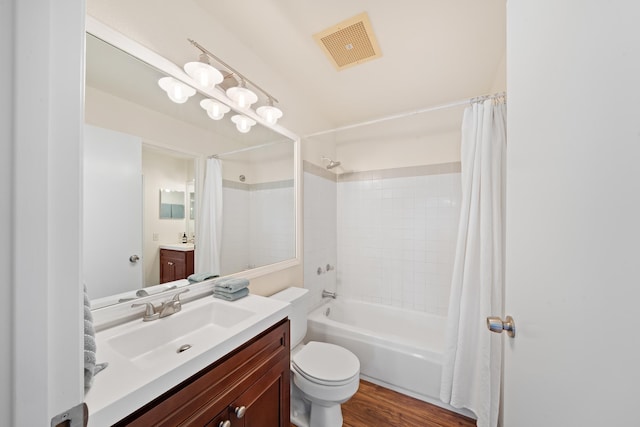 full bathroom featuring shower / bath combo, vanity, toilet, and wood finished floors