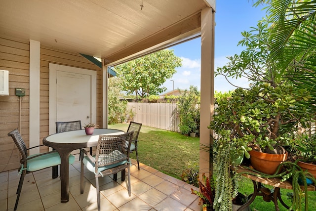 view of patio / terrace featuring outdoor dining space and fence