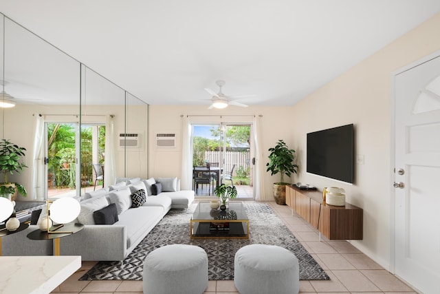 living room with a ceiling fan, light tile patterned floors, plenty of natural light, and a wall mounted air conditioner