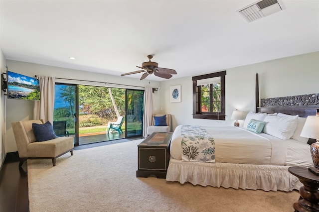 carpeted bedroom with multiple windows, access to exterior, and ceiling fan