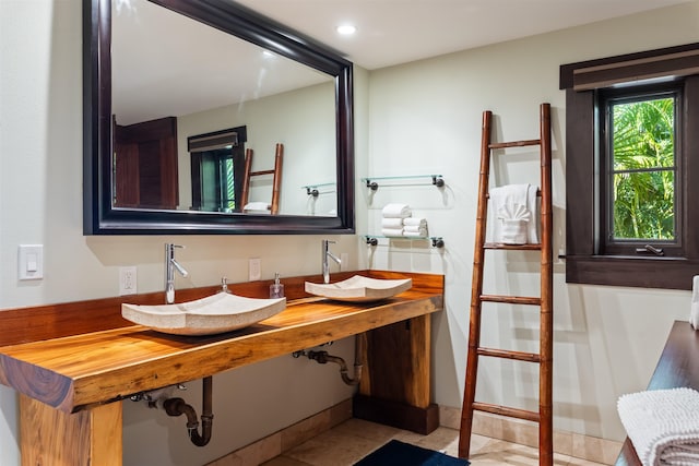 bathroom featuring tile patterned flooring and sink