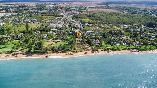 drone / aerial view featuring a water view and a view of the beach