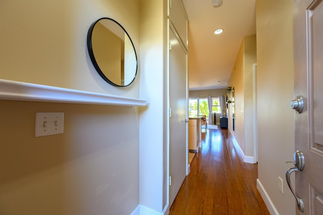 hall featuring dark wood-type flooring