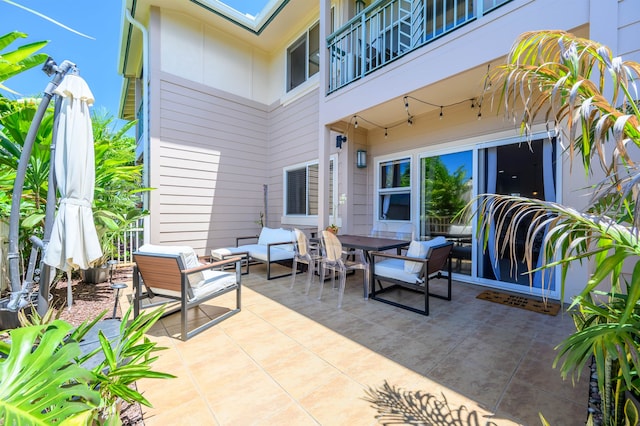 view of patio / terrace featuring an outdoor living space and a balcony