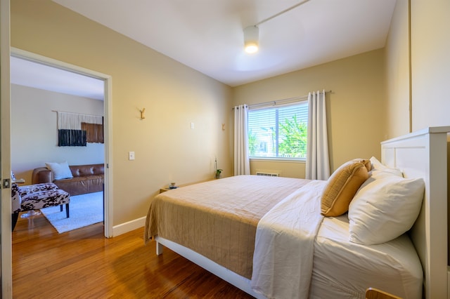 bedroom with wood-type flooring