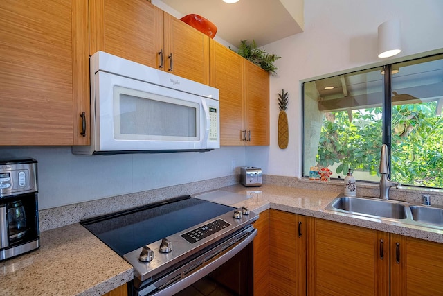 kitchen with sink and stainless steel electric stove