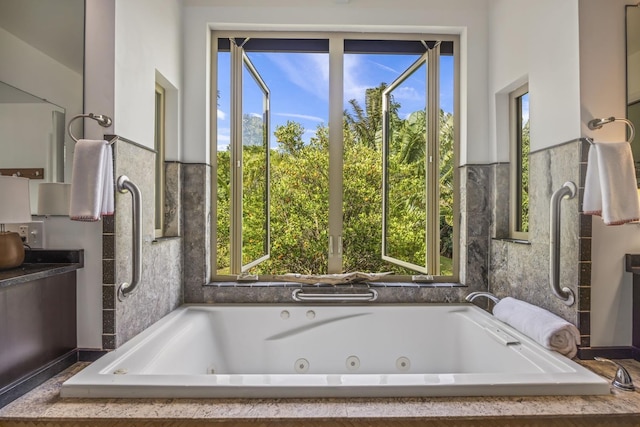 full bath featuring a tub with jets