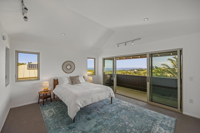 carpeted bedroom featuring vaulted ceiling, access to outside, multiple windows, and baseboards