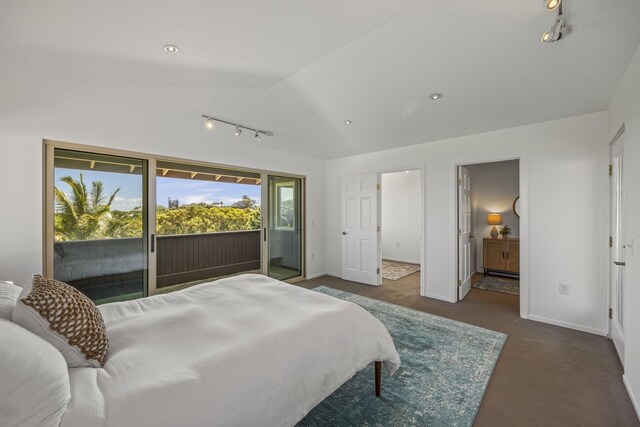 bedroom featuring lofted ceiling, rail lighting, access to exterior, and dark carpet