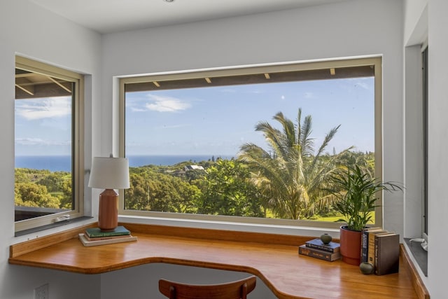 sitting room featuring a water view