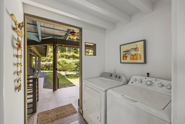 clothes washing area with light colored carpet, washing machine and clothes dryer, and ceiling fan