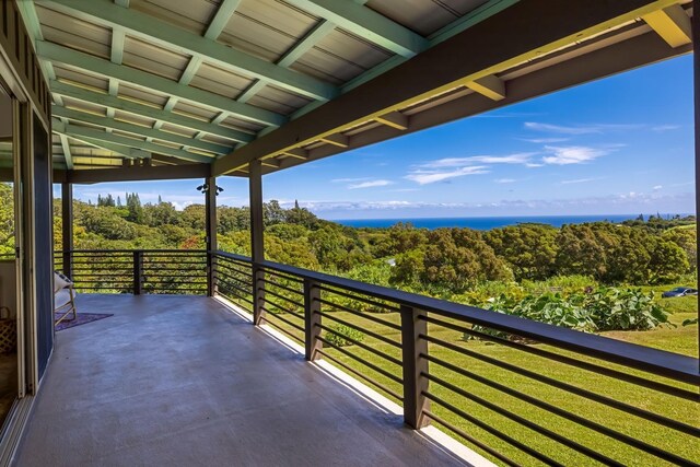 balcony featuring a water view