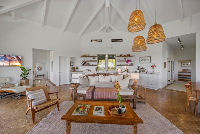 living room with high vaulted ceiling, beam ceiling, and light tile patterned flooring