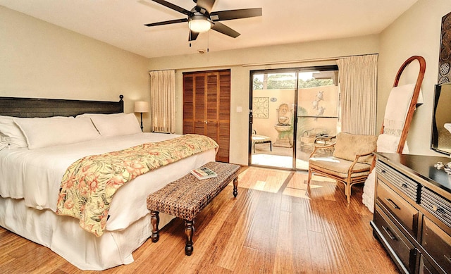 bedroom featuring hardwood / wood-style floors, access to exterior, and ceiling fan