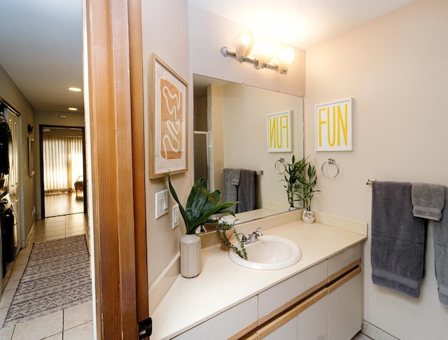 bathroom with tile patterned floors and vanity