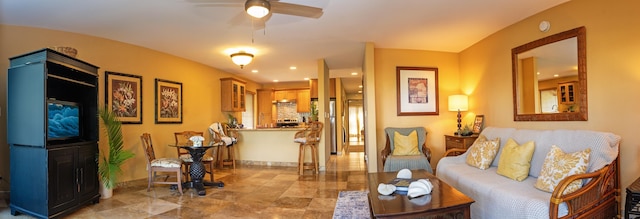 living room featuring ceiling fan