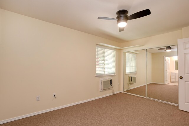 unfurnished bedroom featuring a closet, carpet floors, cooling unit, and ceiling fan