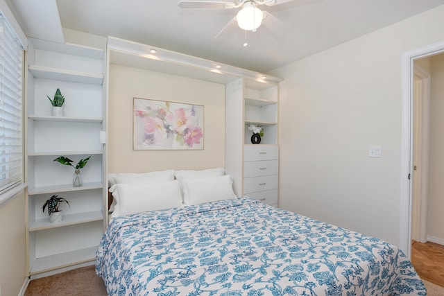 carpeted bedroom with ceiling fan