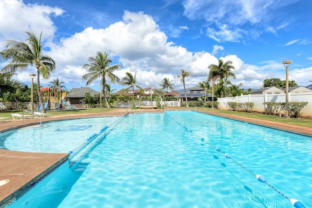 view of pool featuring a playground