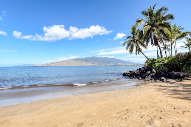 property view of water with a mountain view and a beach view