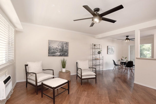 sitting room with ornamental molding, dark hardwood / wood-style floors, and a wealth of natural light