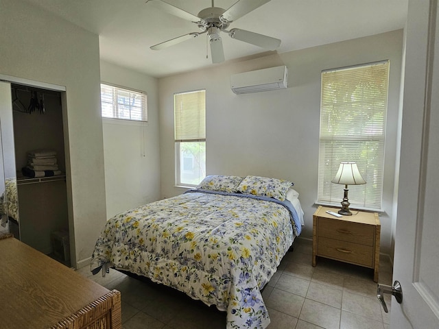 160 Kuli Puu St, Kihei, HI 96753 - tiled bedroom featuring a wall mounted AC, a closet, and a ceiling fan