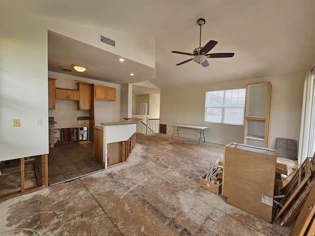 160 Kuli Puu St, Kihei, HI 96753 - kitchen featuring lofted ceiling, ceiling fan, brown cabinetry, and a center island