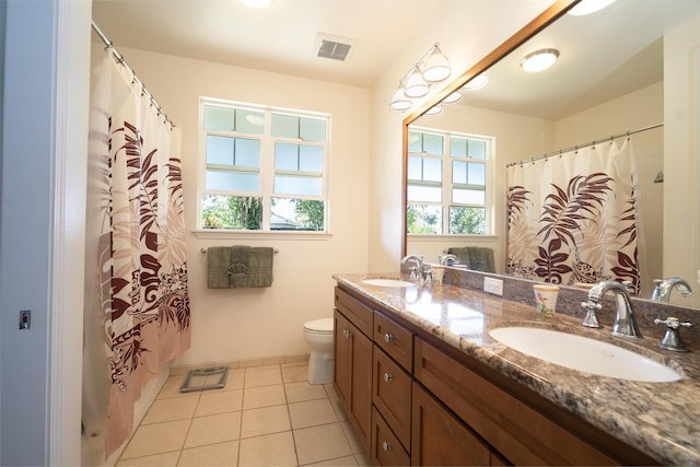 full bath with double vanity, tile patterned flooring, visible vents, and a sink