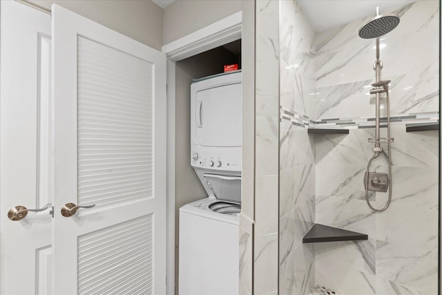 laundry area featuring stacked washer / dryer