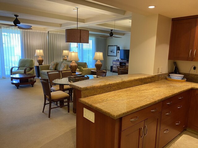2481 Kaanapali Pkwy Unit 620V, Lahaina, HI 96761 - kitchen featuring a ceiling fan, a peninsula, open floor plan, beamed ceiling, and light colored carpet