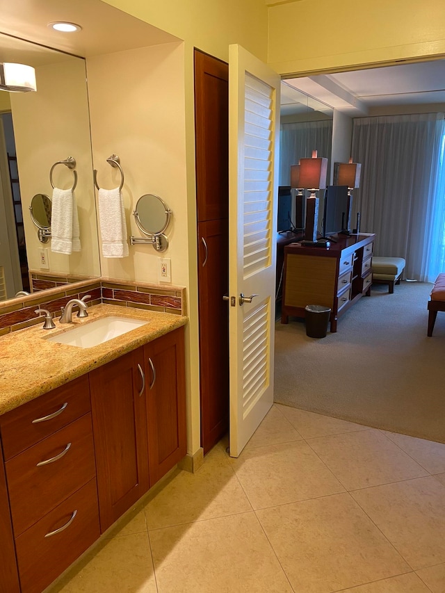 bathroom with vanity and tile patterned flooring