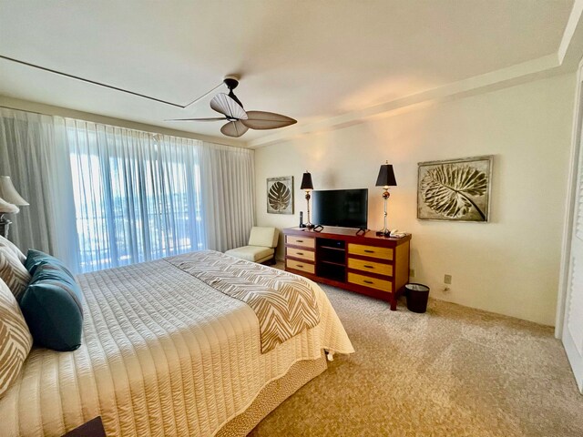 carpeted bedroom featuring ceiling fan