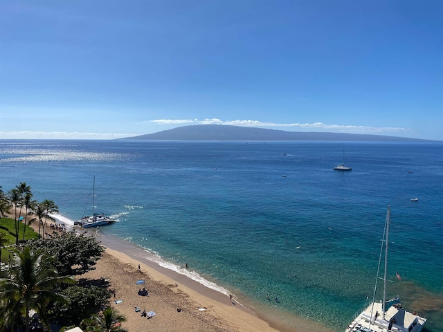 property view of water featuring a mountain view and a beach view