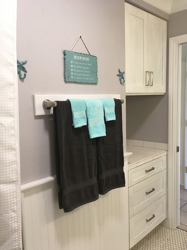 bathroom featuring tile patterned floors and vanity