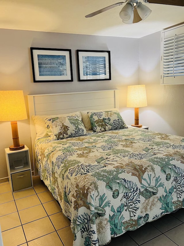 bedroom featuring ceiling fan and light tile patterned floors