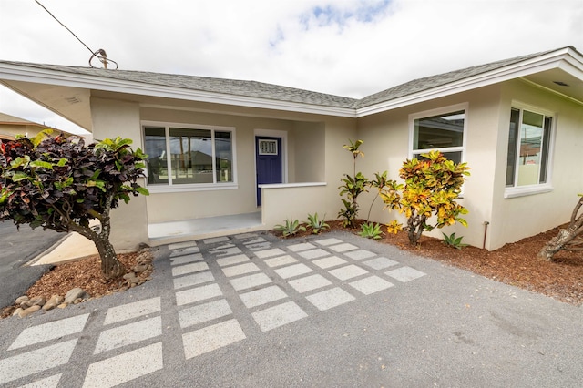 property entrance with a patio