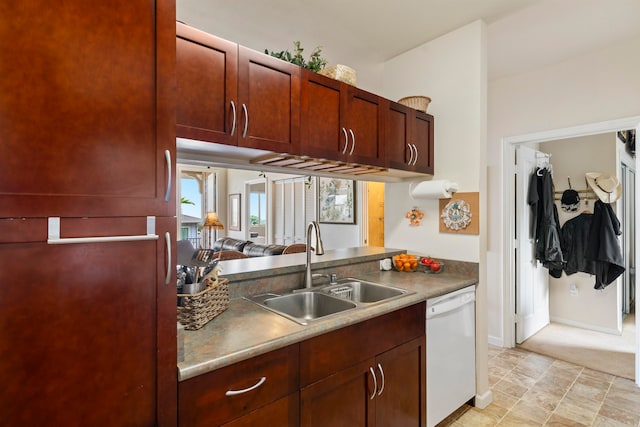 kitchen with fridge, sink, and white dishwasher