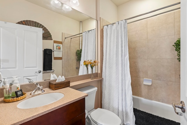 full bathroom featuring vanity, toilet, and shower / tub combo