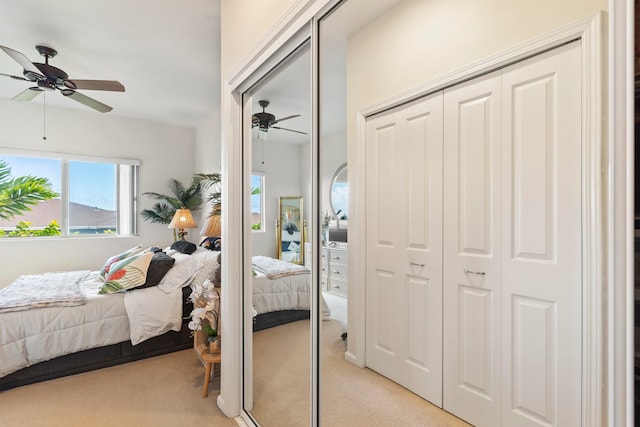 carpeted bedroom with ceiling fan