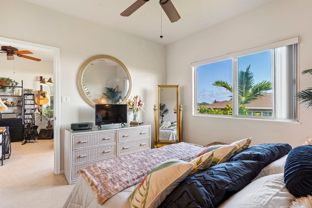 bedroom featuring light carpet and ceiling fan