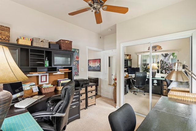 carpeted office with ceiling fan