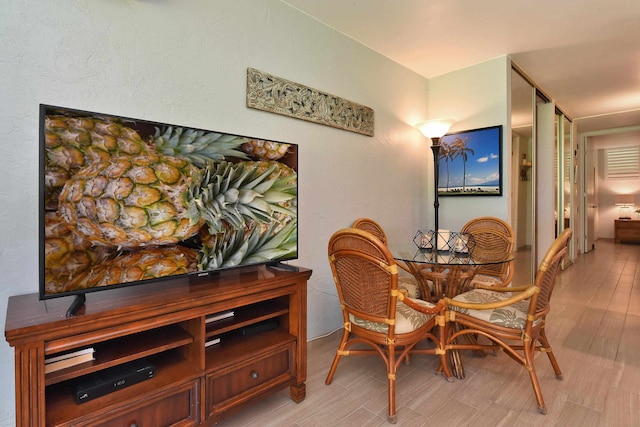 dining space featuring light hardwood / wood-style floors